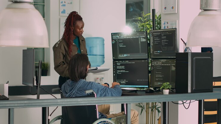 Asian programer with chronic impairment working on software code