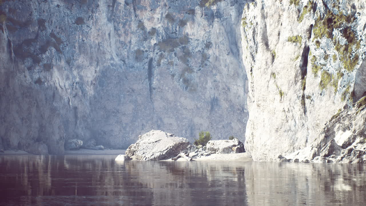 Rocky cliffs surround calm waters at a serene natural location