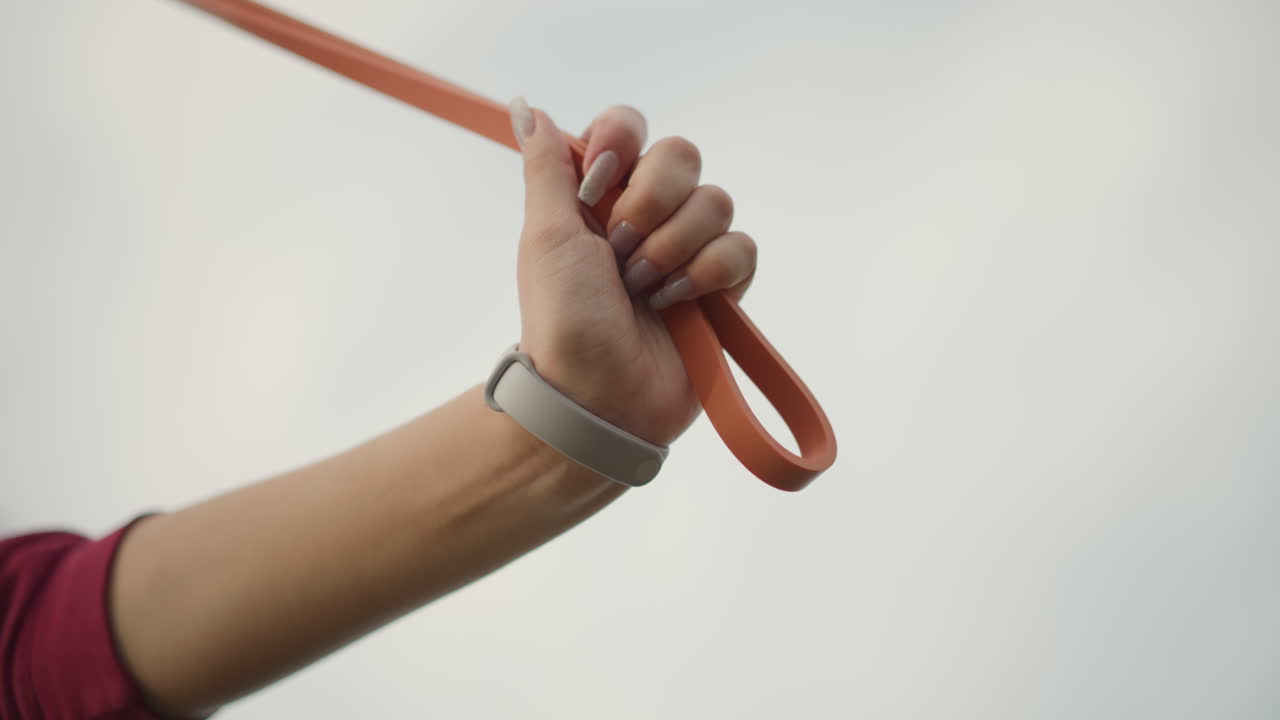 Individual Lifts Vivid Leash High, Person Lifts Vibrant Leash Into Clouds Symbolizing Hope And Freedom, An Individual Lifts Brightly Colored Leash Into Sky To Symbolize Hope And Liberation