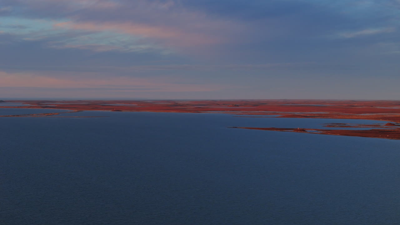 Panoramic Landscape Of Tuktoyaktuk Located On The Shore Of Arctic Ocean In Northwest Territories, Canada. drone shot