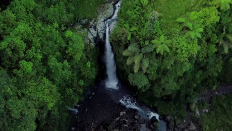 aerial view from drone flying over nature view of waterfall in the middle of forest