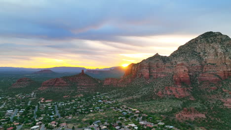 aerial view of residential houses in west sedona with natural sandstone mountains at dusk in sedona, arizona, usa