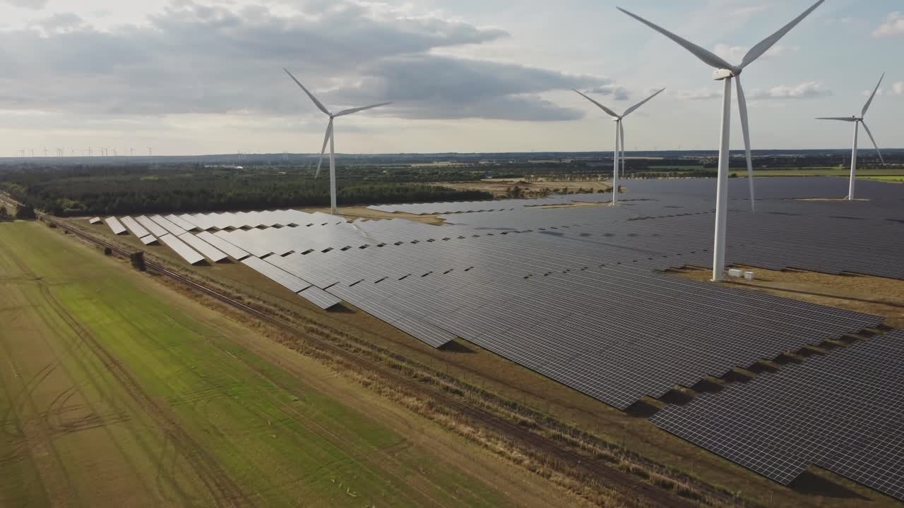 Wind Turbine And Solar Cells Near Wheat Field Crop In A Farmland Near Holstebro, Denmark