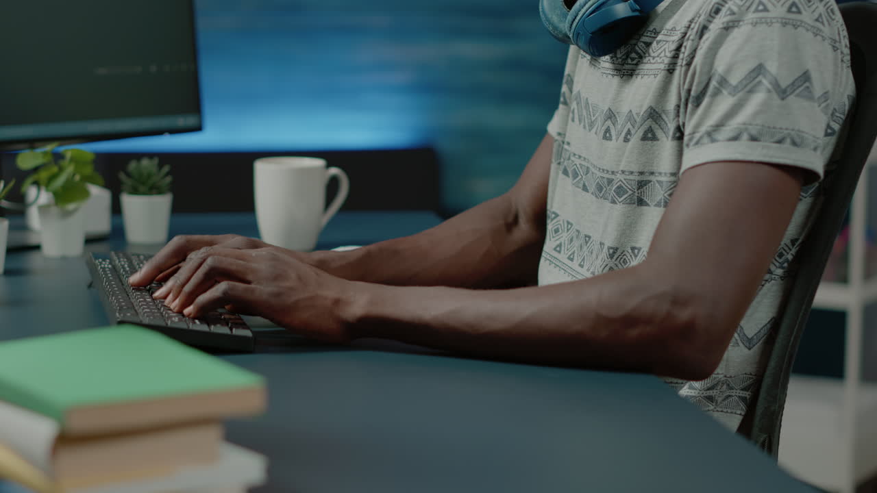 Close up of black hands coding server interface with binary codes