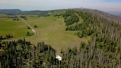 aerial view of mountain landscape with forest and road