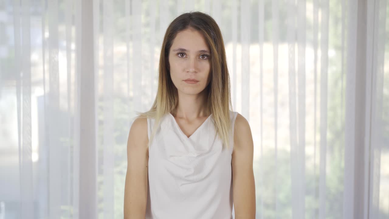 Young woman looking calmly at camera.