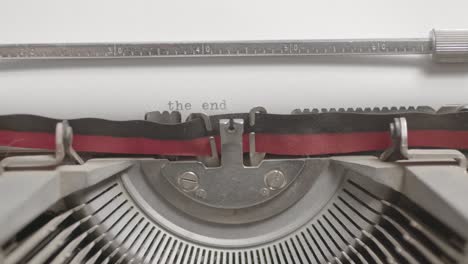 Closeup-of-a-typewriter-machine-writing-The-End