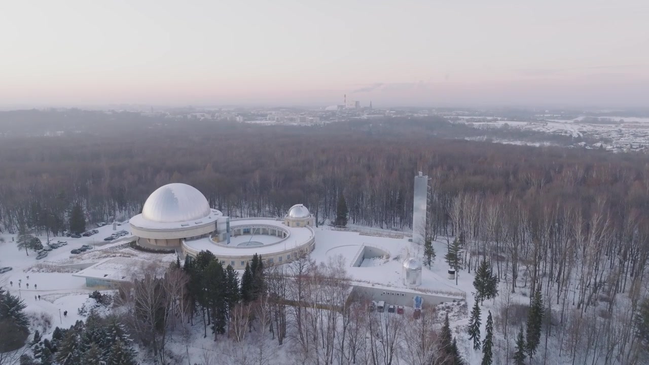 Drone shots of Silesian Park in winter, featuring the Silesian Planetarium.
