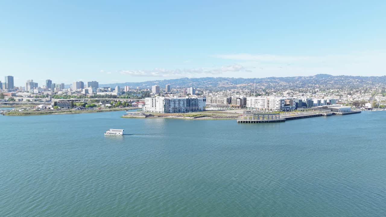 From the sky, Oakland’s waterfront shows a patchwork of piers, rooftops, and gentle water movement.