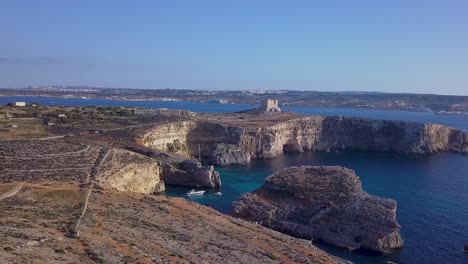 the blue lagoon malta is a small lagoon with relatively shallow, crystal clear water that’s located on the island of comino, between malta and gozo