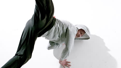 cool young break dancer dancing on white background