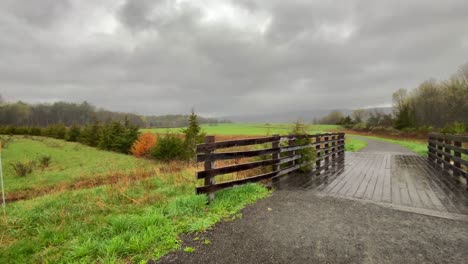 A-beautiful-wooden-pedestrian-footbridge-in-grasslands-in-the-Appalachian-mountains