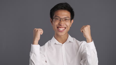 Asian-man-showing-yes-gesture-to-the-camera.