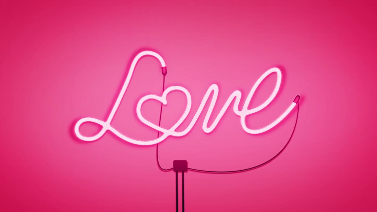 네온 표지판에는 분홍색 배경에 밝은 색으로 사랑이라는 단어가 적혀 있습니다.