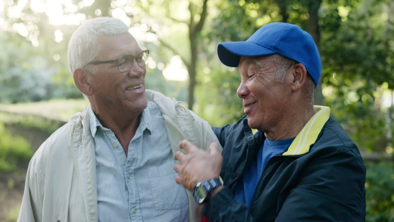 Two happy senior men enjoying time together in a park