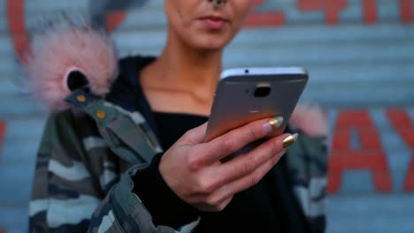 woman using mobile phone outside shop 4k