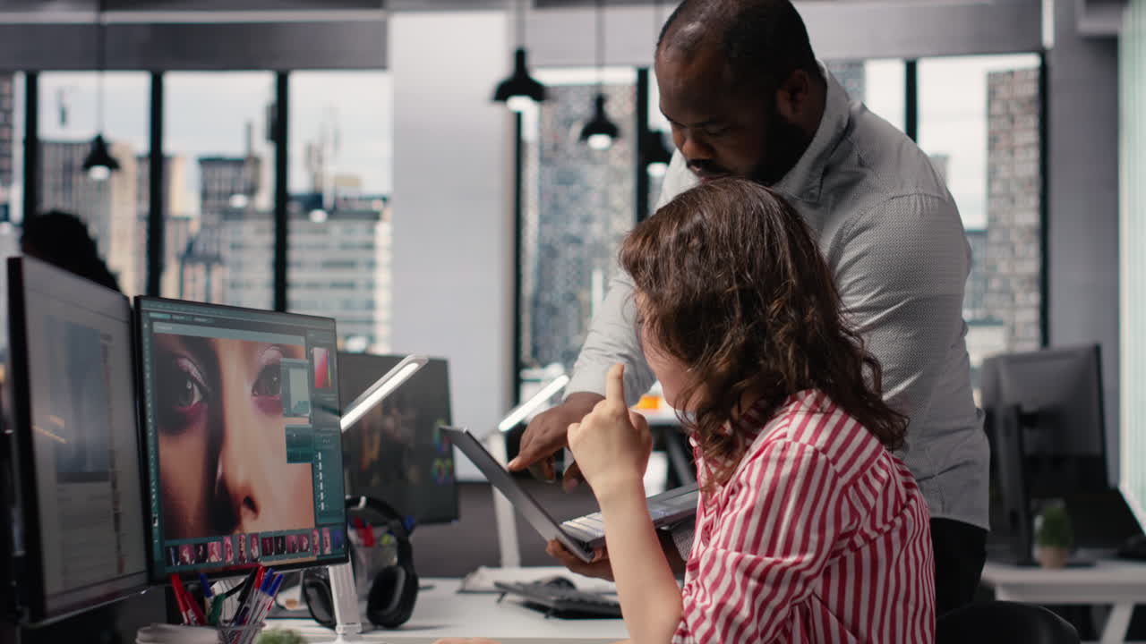 Creative Professionals Collaborating on Photo Editing in Modern Office