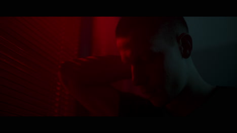 close-up of a person in a dimly lit room