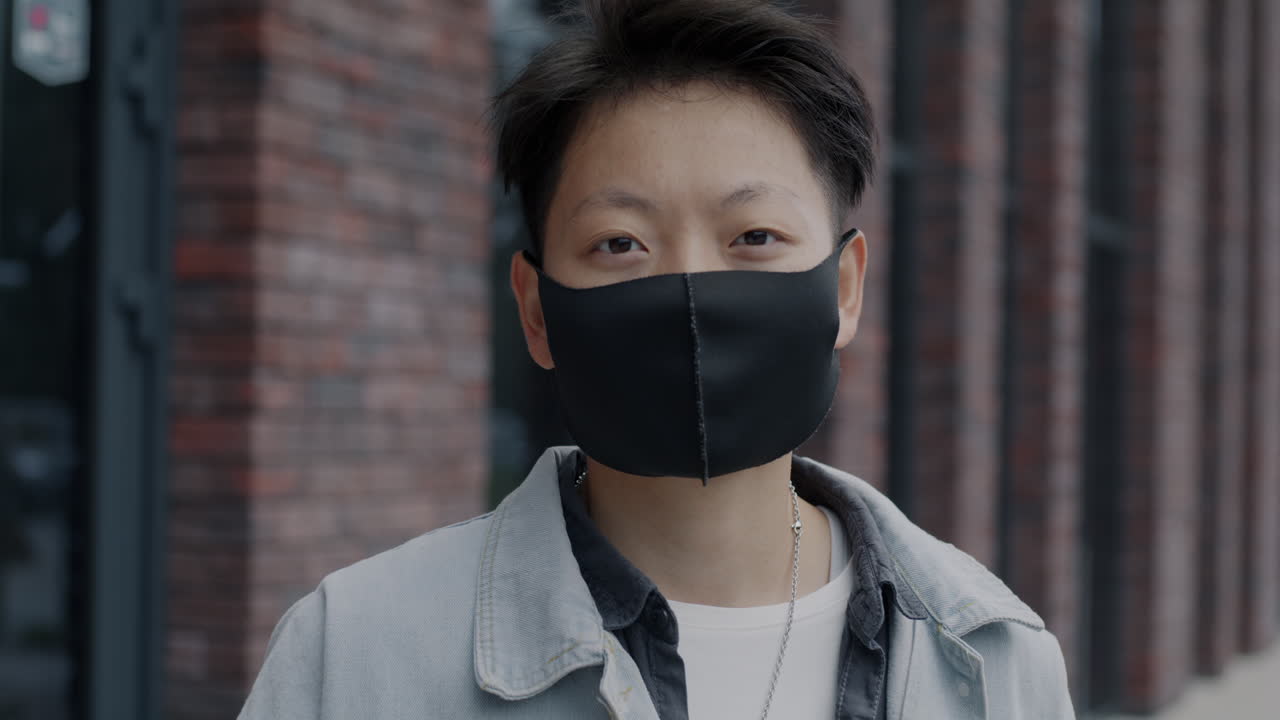 Person wearing a face mask outdoors