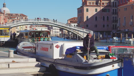 man in a boat in venice canal