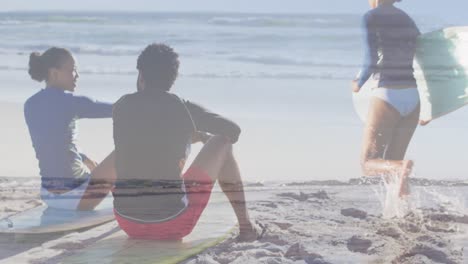 Animation-of-happy-african-american-couple-with-surfboards-on-beach