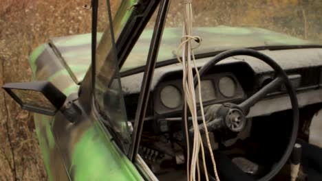 interior of an old, dirty, camo-patterned car