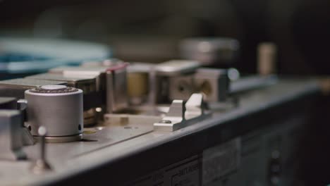 hand opens up audio tape recorder case and close down after playing, close up shot