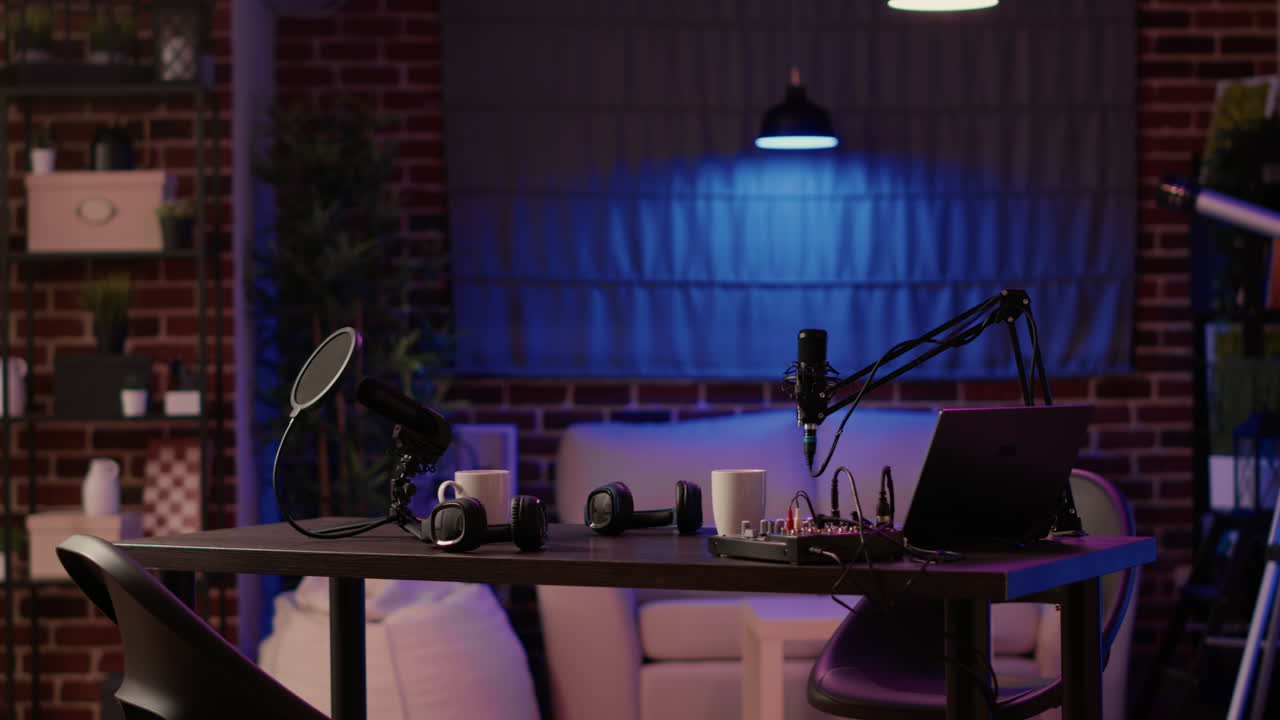 Nobody in cozy ambient room with podcast equipment, microphone and headphones