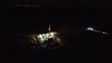 Fire-Department-Operation-Near-An-Oil-Drilling-Station-At-Nighttime---Aerial-Shot