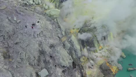 dramatic aerial view of a crater acid lake kawah ijen where sulfur is mined