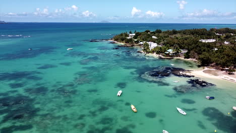 aerial view of fishing and speedboat in transparent blue water at sunny day