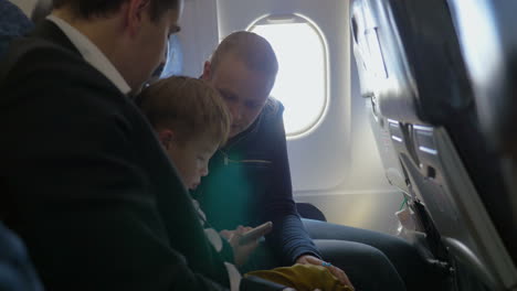 parents and little son traveling by air