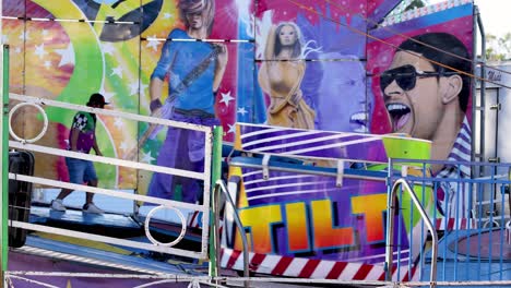 people enjoying a spinning amusement park ride