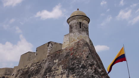 flag waving in wind at fort in cartagena colombia