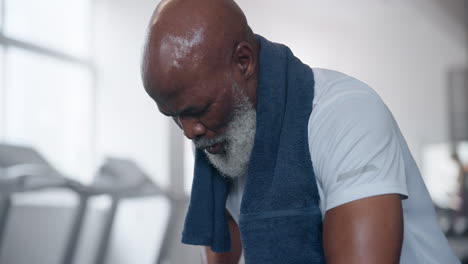 senior man taking a break after exercise