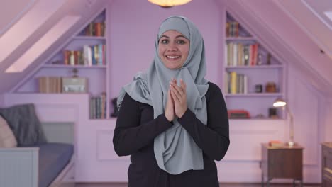 happy muslim woman clapping and appreciating