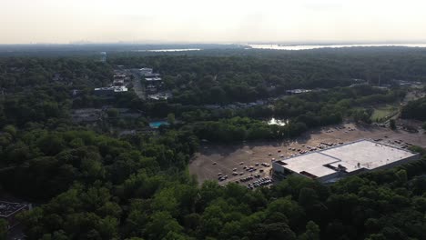 aerial view of a suburban area with a city skyline in the distance