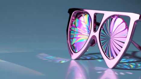 pink glasses with holographic lenses casting colorful reflections