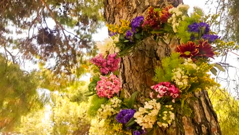 wreath of flowers hanging from a tree on 1st of may labour day in greece.