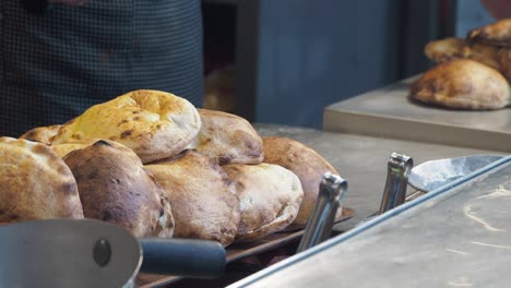 freshly baked pita bread in a restaurant kitchen