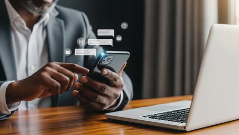 a professional man engaging with his smartphone while working at a desk, highlighting modern communication tools and digital interactions in the workplace context