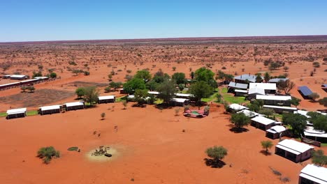 A-drone-shot-of-a-lodge-in-Namibia-with-small-houses-and-a-pool