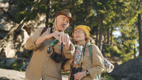 senior couple hiking in the mountains