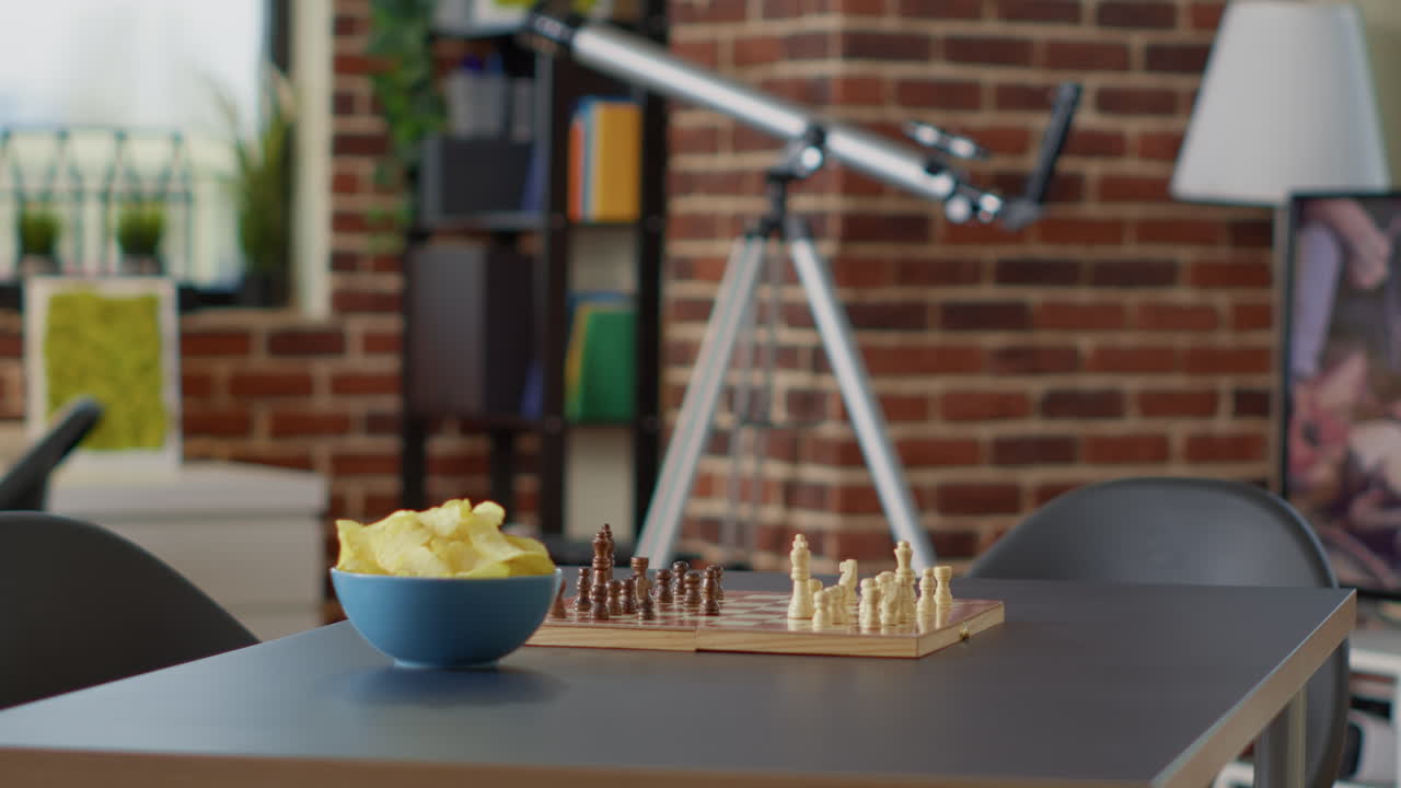 Empty interior with chess board game and chips on table