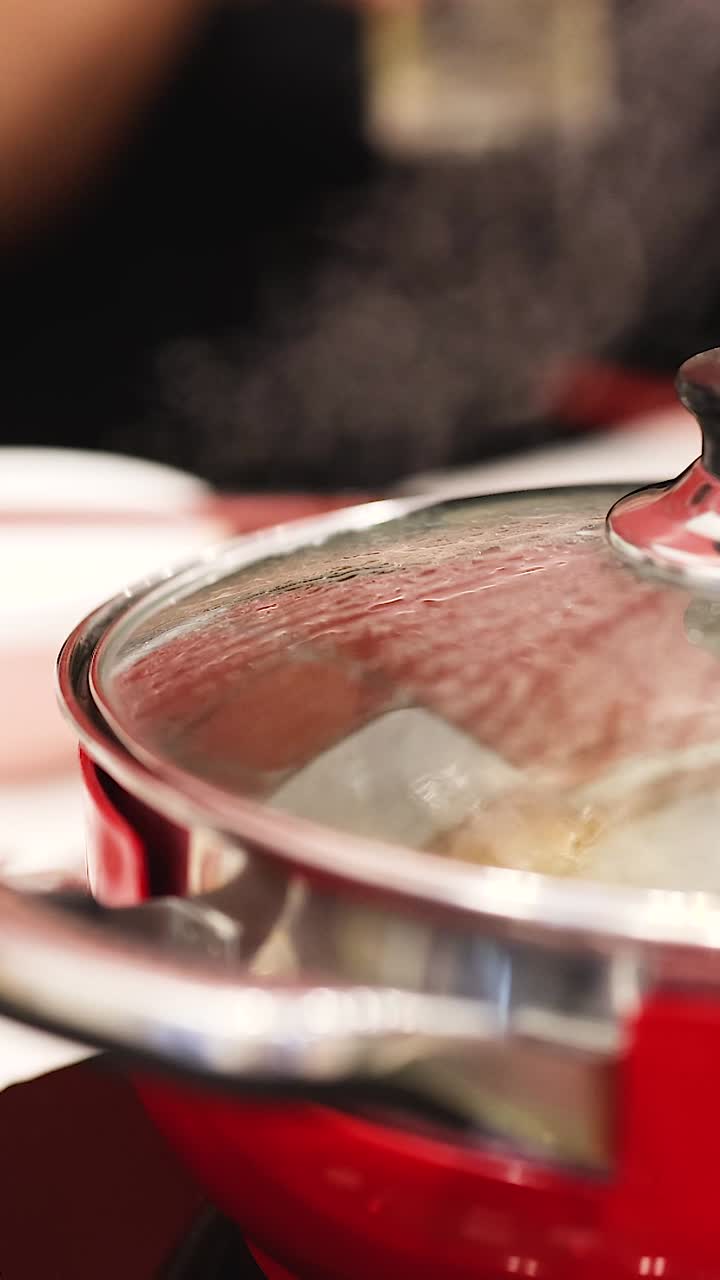 Steaming food in a red pot