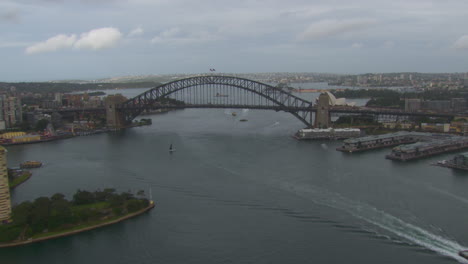 sydney harbour bridge by opera house in australia, aerial drone flight