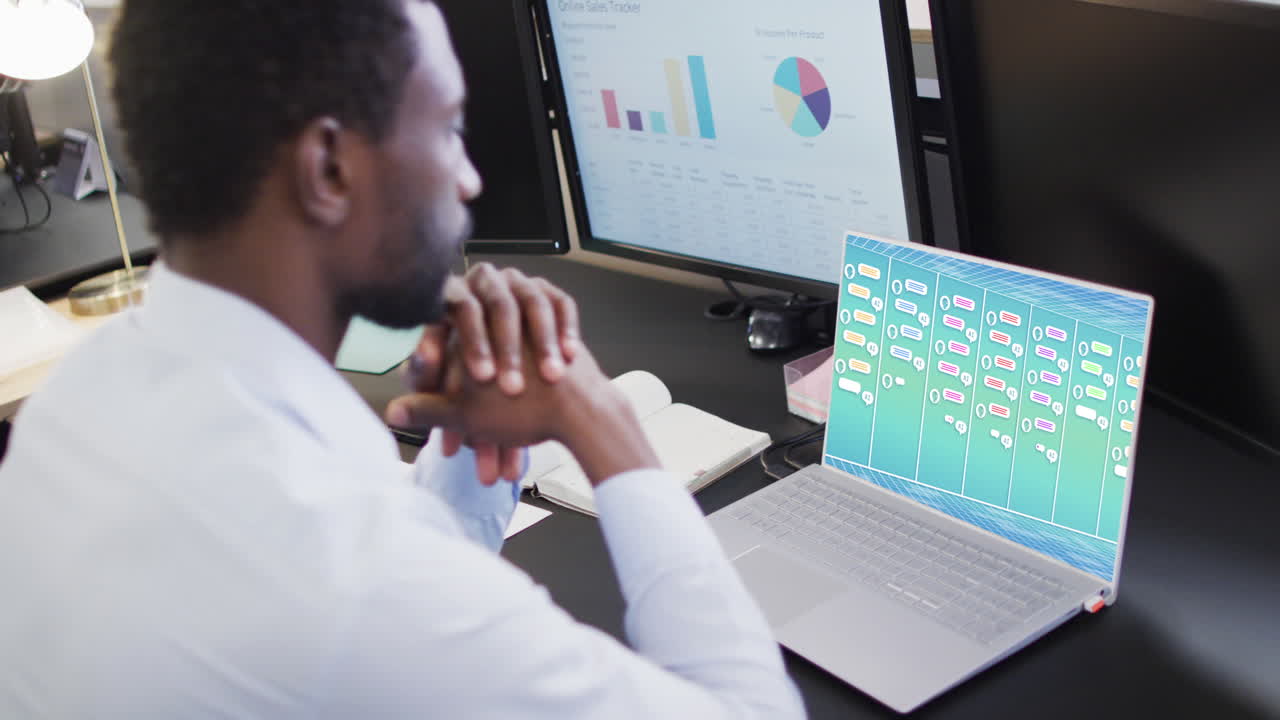 Composition of african american businessman using laptop with ai chat on screen