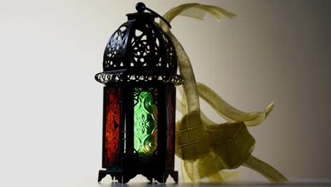 ribbon ketupat and arabic lantern on turntable turning 360 degree