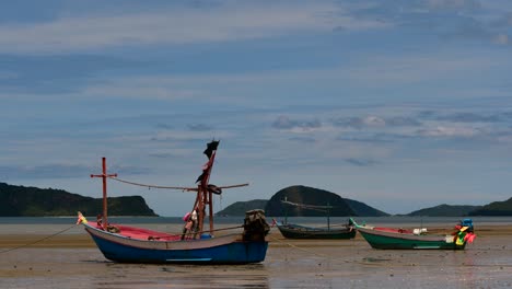 fishing boats mooring in low tide are usually seen as part of a romantic provincial seascape of khao sam roi yot national park, prachuap khiri khan, in thailand