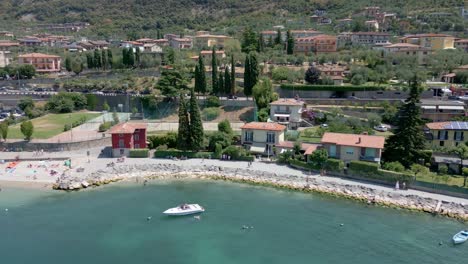 aerial truck shot of houses on lake garda in italy